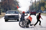 Mike Middleton acts as lunchtime crossing guard in his wheelchair for Berry Elementary School kindergartners by Bruce Maxwell