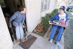 Mike Burgess (right) talks with Kent Jewkes at apartment by Kevin Geil