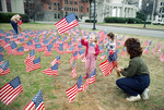Johanna and Peggy Hoshall placing American flags in Dealey Plaza by Rodger Mallison