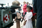 Jasmine Evans being interviewed after gifting Queen Elizabeth II with flowers by Larry C. Price