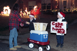 Kristin Wayne and Chad Marrou selling concessions to Kellie Marrou at Interlochen light display by Willis Knight