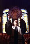 Congregation Beth-El's Rabbi Ralph Mecklenburger holding up Passover plate