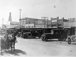 Model T cars parked in center of street