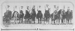 The Texas Rangers on horseback carrying rifles