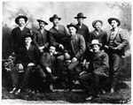 Group of cowboys posed for a formal portrait