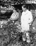 Professional golfer Byron Nelson with his mother in her garden