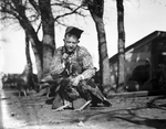 Harold Hough holding a turkey at a farm