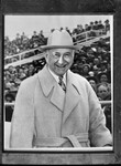 Composite photo of Amon Carter wearing white coat and hat