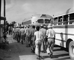 Workers from Mexico board deportation buses at the McAllen, Texas detention center