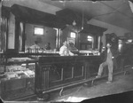 Two men standing at the bar in a Thurber, Texas saloon