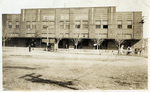 Two-story General Office building with two horse-drawn carts in front, Thurber, Texas