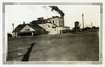 Street scene with mining buildings, water tower and smoke stacks, Thurber, Texas by Baxley's Studio