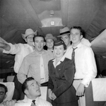 Arlington State College Rebels football team in flight, with American Airlines stewardess, to 11th Annual Junior Rose Bowl