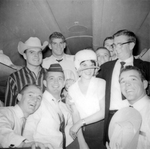 Arlington State College Rebels football team in flight, with American Airlines stewardess, to 11th Annual Junior Rose Bowl