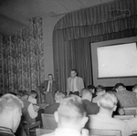 Arlington State College Rebels football team meeting, Chena Gilstrap addressing the team, 11th Annual Junior Rose Bowl