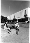 Two students in front of UTA's Hereford Student Center