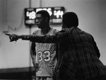 UTA basketball coach Bob "Snake" LeGrand with Movin' Mavs player #33