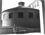 UTA's Roundhouse with student sitting in front