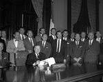 Governor John Connally holding bill for making Arlington State College a four-year institution