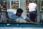 UTA students playing pinball machines and pool