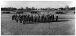 Reserve Officers' Training Corps (R. O. T. C.) students in uniform and drill formation on field at Arlington State College (A. S. C.)