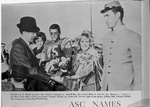 ASC president J. R. Woolf presents bouquet to Judy Webb, Miss Dixie Belle