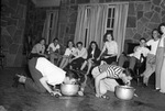 North Texas Agricultural College (N. T. A. C.) party with students bobbing for apples