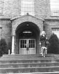 Student walking by Ransom Hall, University of Texas at Arlington (U. T. A.)