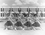 Cheerleaders posed in front of new Library, Arlington State College (A. S. C.)