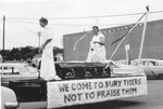 Arlington State College (A. S. C.), two students dressed as Roman patricians riding on homecoming float