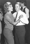 Couple dancing and wearing Arlington State College (A.S.C.) beanies