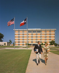 Couple walking in front of University of Texas at Arlington's new six-floor library