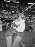 UTA women's volleyball team celebrates victory against the University of Texas