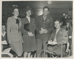 Photo of Warren C. Cowen and three unidentified people