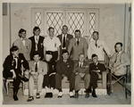 Photo of Warren C. Cowen and a group of unidentified men