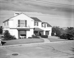 Residential home with parking garages by W. D. Smith