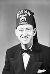 Portrait photograph of Bob Blevens in Patrol fez by W. D. Smith