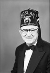 Portrait photograph of Bob Lee in Director General fez by W. D. Smith