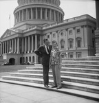 Man and young boy in front of Capitol Building by W. D. Smith