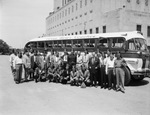 Moslah group in front of Texas Motor Coaches bus by W. D. Smith