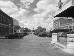 Cars in parking lot of Texan Theater by W. D. Smith