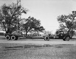 A truck with a trailer attached by W. D. Smith