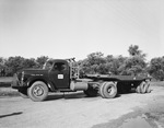 A truck with a trailer attached by W. D. Smith