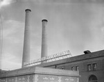 The Texas Electric Company's neon sign is lit against the evening sky in Fort Worth by W. D. Smith