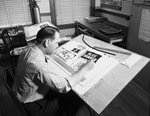 Office worker designing a poster by W. D. Smith