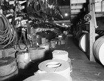 Interior of warehouse with aisles of stock by W. D. Smith