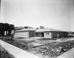 Robertson-Mueller-Harper Funeral Home under construction by W. D. Smith