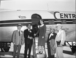 Group of men by Central Airlines plane at Carter Field by W. D. Smith