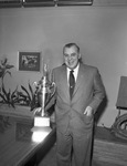 Spencer Harris with attendance trophy by W. D. Smith