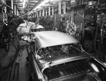 General Motors plant employees working on car by W. D. Smith